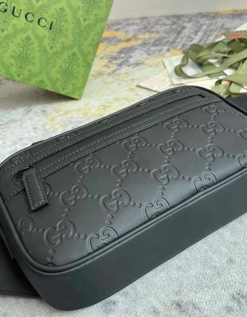 Monogram-debossed Leather Cross-body Bag