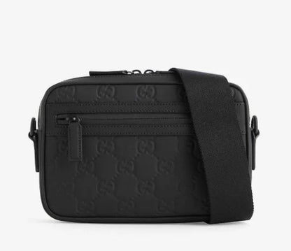 Monogram-debossed Leather Cross-body Bag